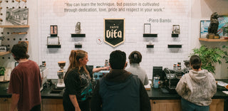 Caffe Vita trainers and educators teaching a public class on how to use an espresso machine.