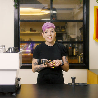 Sam Spillman teaching how to pull a shot of espresso.